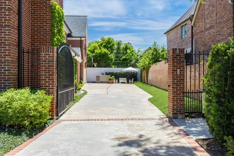 a view of a backyard with sitting area
