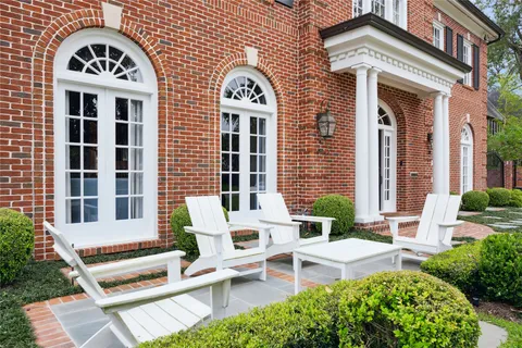 a view of a brick house with a large windows