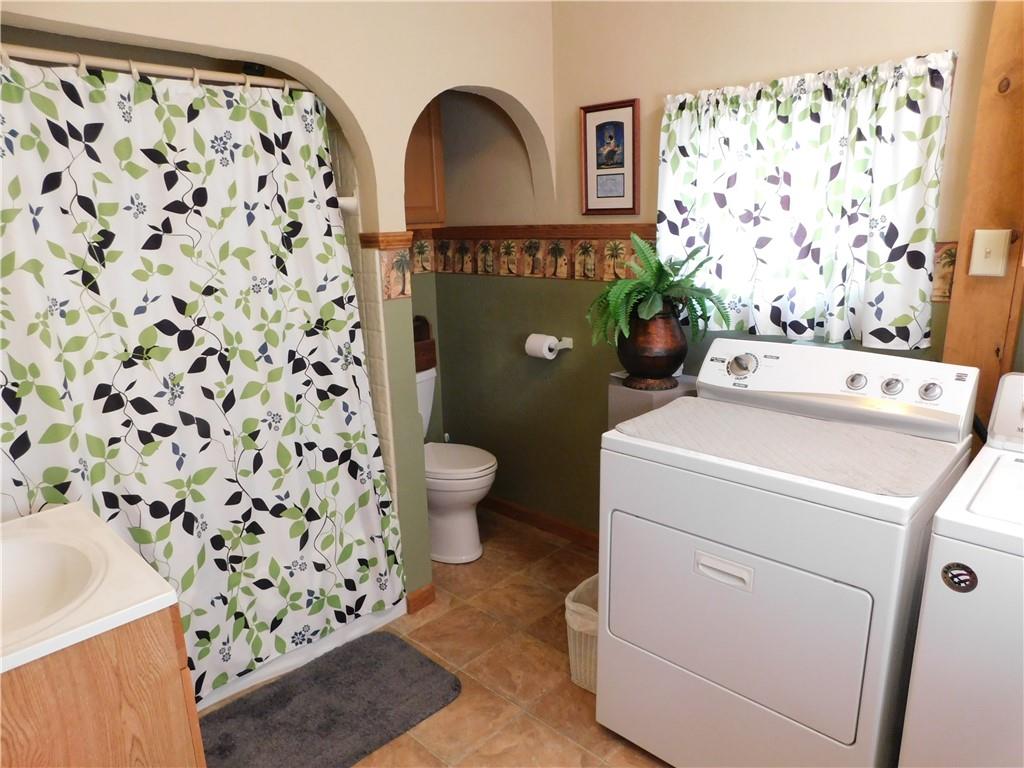 3941 Hollow Road New Castle, PA 16101 - Photo 4 of 12 a view of bathroom with a toilet and a shower curtain