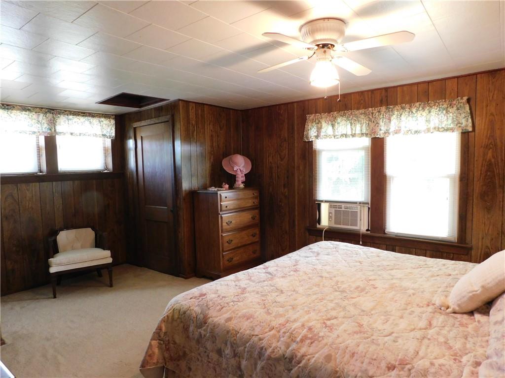 3941 Hollow Road New Castle, PA 16101 - Photo 5 of 12 a bedroom with a bed and a chandelier