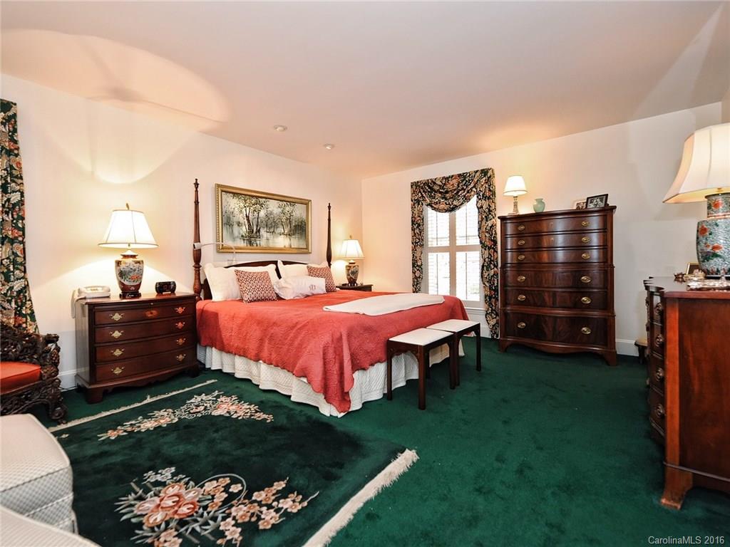 3123 Cloverfield Road Charlotte, NC 28211 - Photo 12 of 24 a spacious bedroom with a bed and a dresser