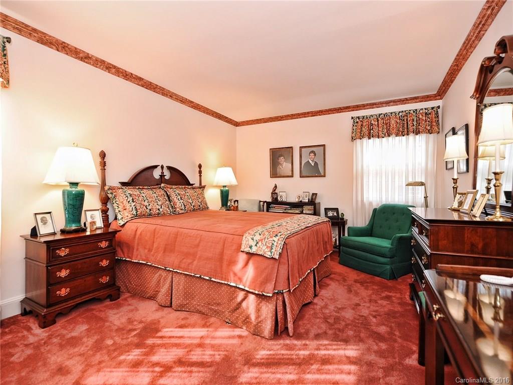 3123 Cloverfield Road Charlotte, NC 28211 - Photo 16 of 24 a bedroom with a bed a window and dresser