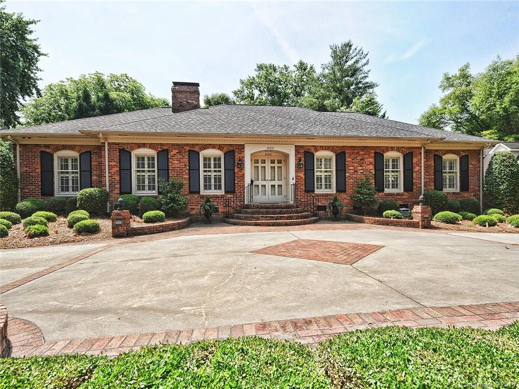 3123 Cloverfield Road Charlotte, NC 28211 - Photo 24 of 24 a front view of a house with yard and potted plants