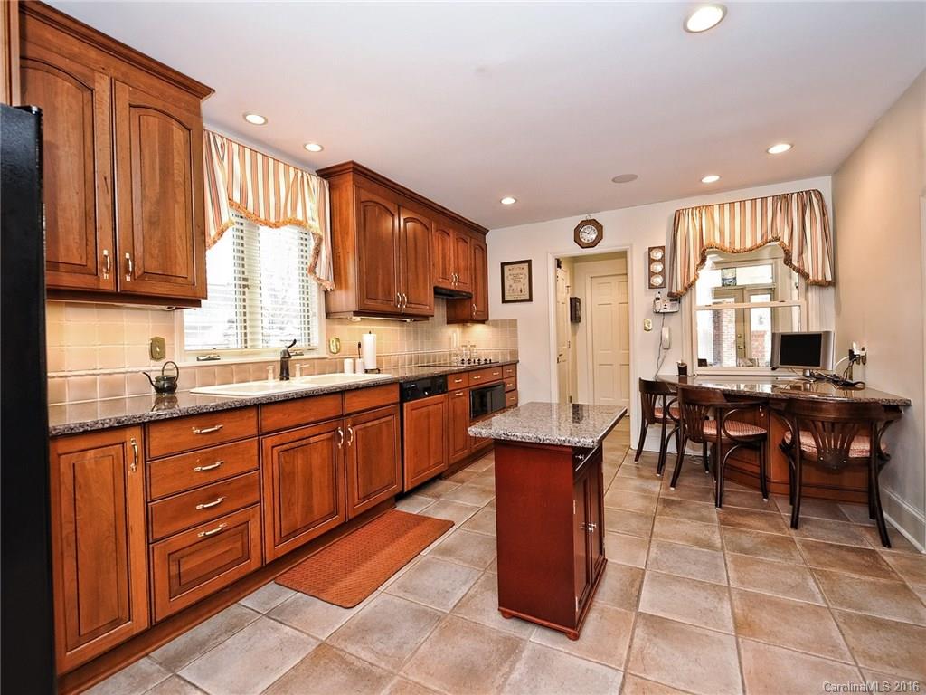 3123 Cloverfield Road Charlotte, NC 28211 - Photo 6 of 24 a large kitchen with stainless steel appliances granite countertop a stove a sink a oven a dining table and chairs
