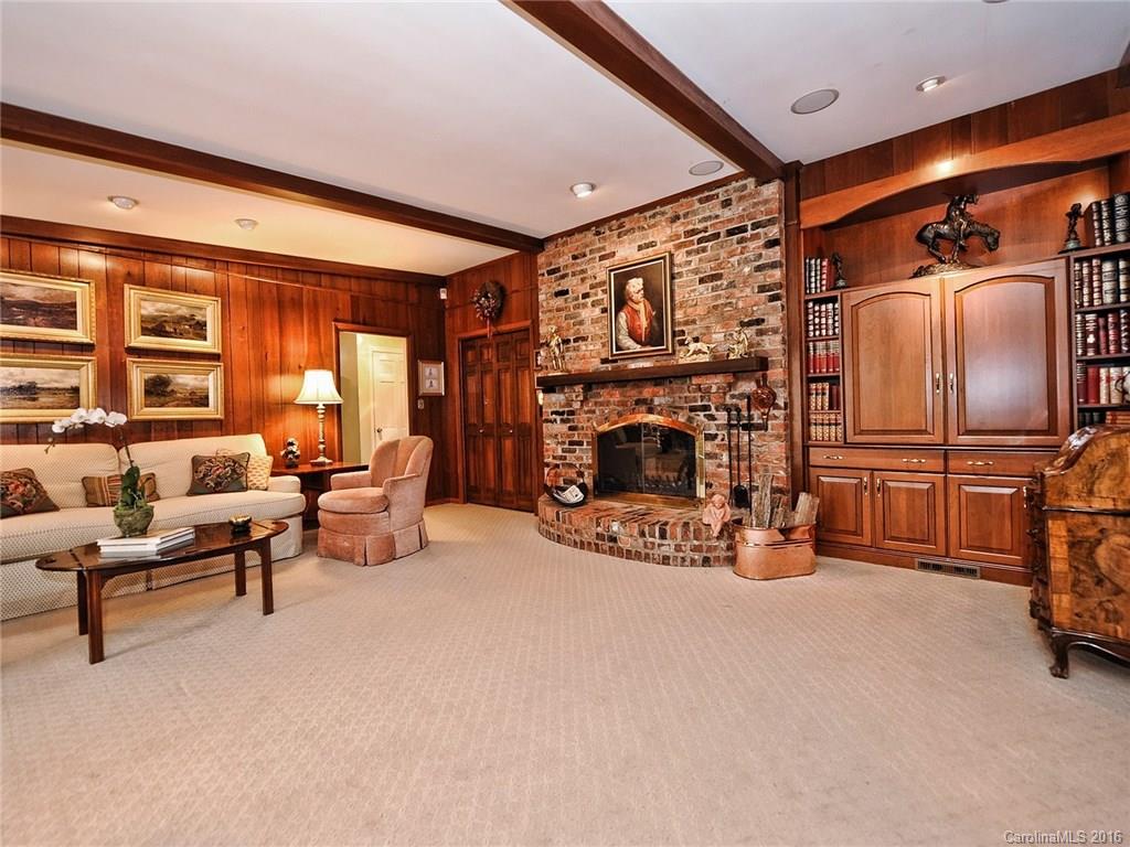 3123 Cloverfield Road Charlotte, NC 28211 - Photo 8 of 24 a living room with furniture a fireplace and a flat screen tv