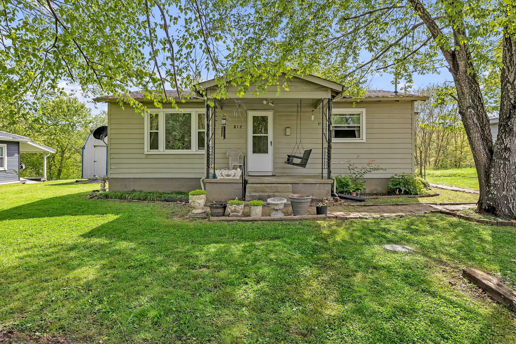 812 Upper Ferry Road Carthage, TN 37030 - Photo 1 of 25 a front view of a house with garden and patio