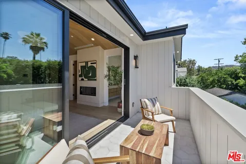 a view of balcony with furniture