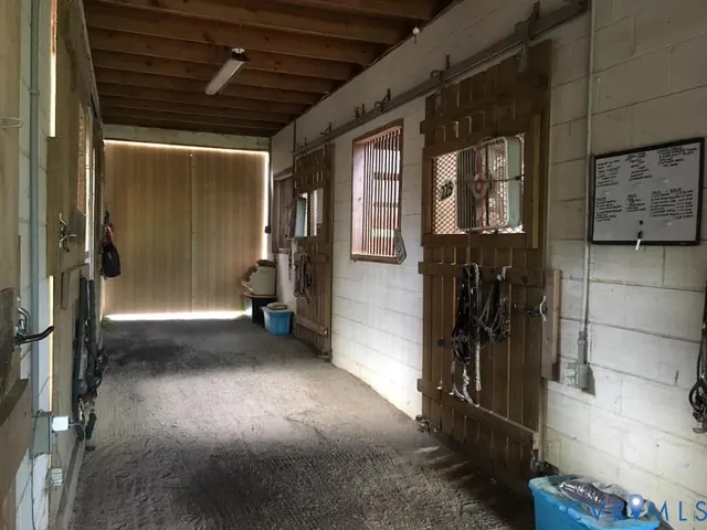 a roof deck with table and chairs
