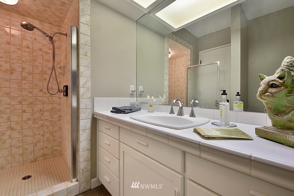 1835 Lancaster Road Freeland, WA 98249 - Photo 12 of 25 a bathroom with a sink and a mirror