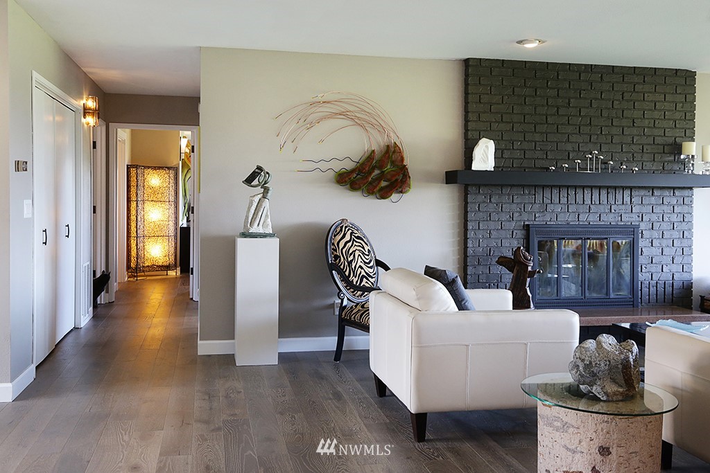 1835 Lancaster Road Freeland, WA 98249 - Photo 14 of 25 a living room with furniture and a fireplace