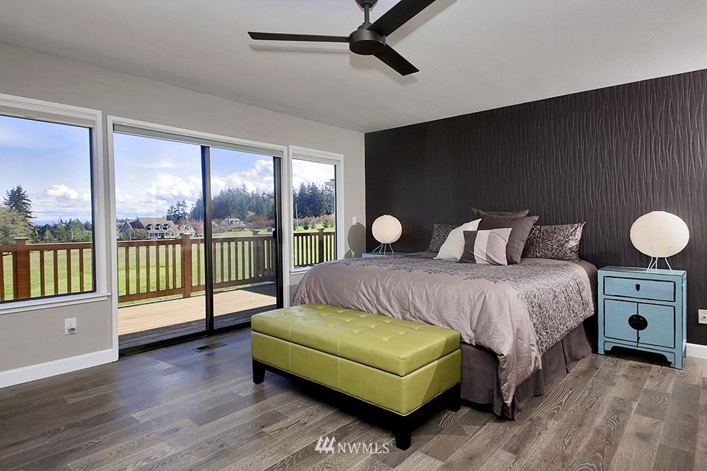 1835 Lancaster Road Freeland, WA 98249 - Photo 15 of 25 a bedroom with a bed and large window