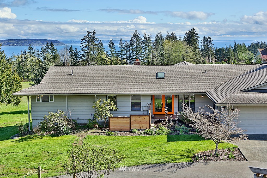 1835 Lancaster Road Freeland, WA 98249 - Photo 3 of 25 a view of a house with backyard sitting area and garden