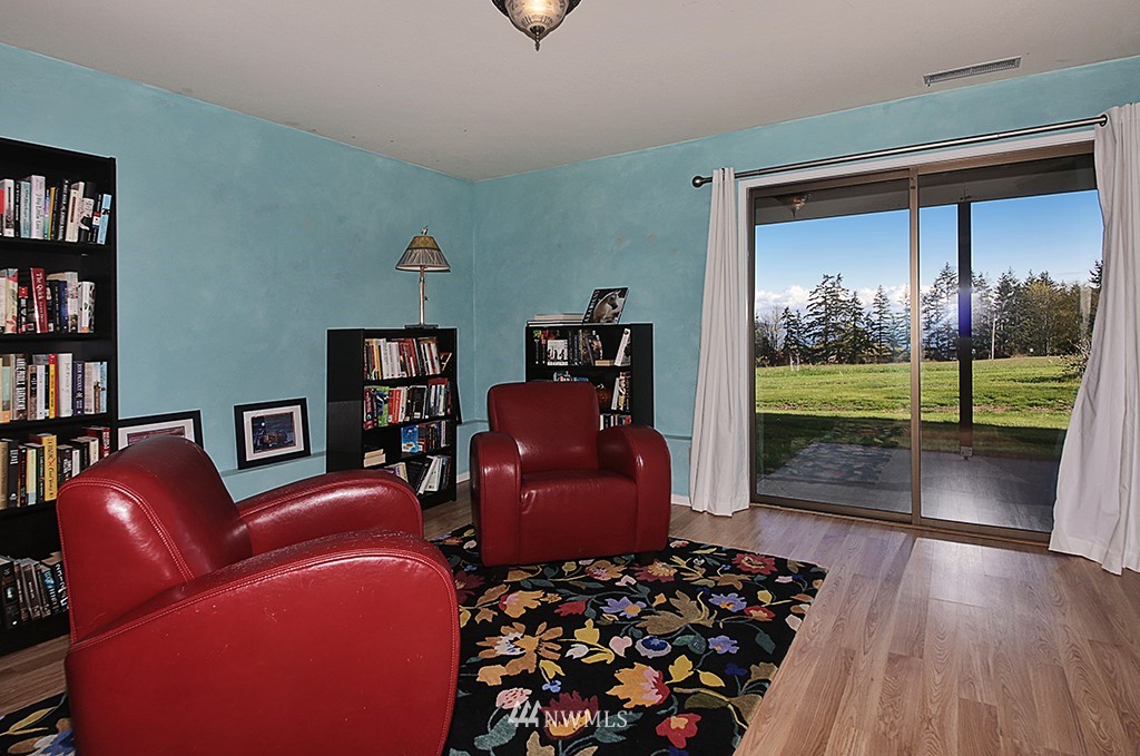 1835 Lancaster Road Freeland, WA 98249 - Photo 21 of 25 a bedroom with furniture and a large window