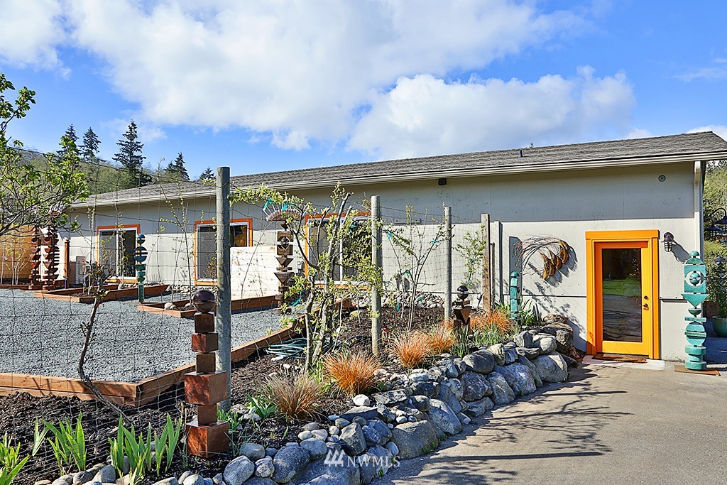 1835 Lancaster Road Freeland, WA 98249 - Photo 23 of 25 a front view of a house with a porch