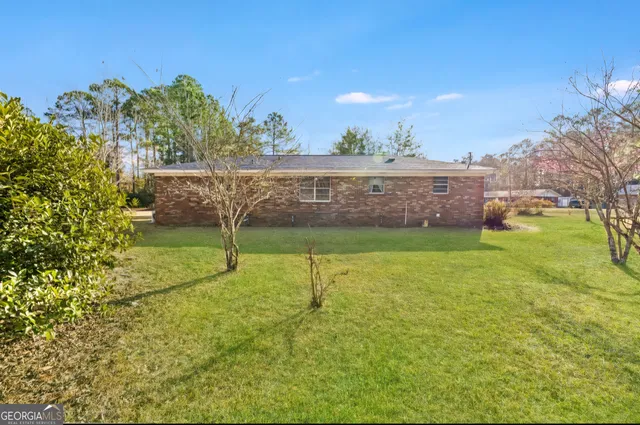 a bathroom with a sink mirror and vanity