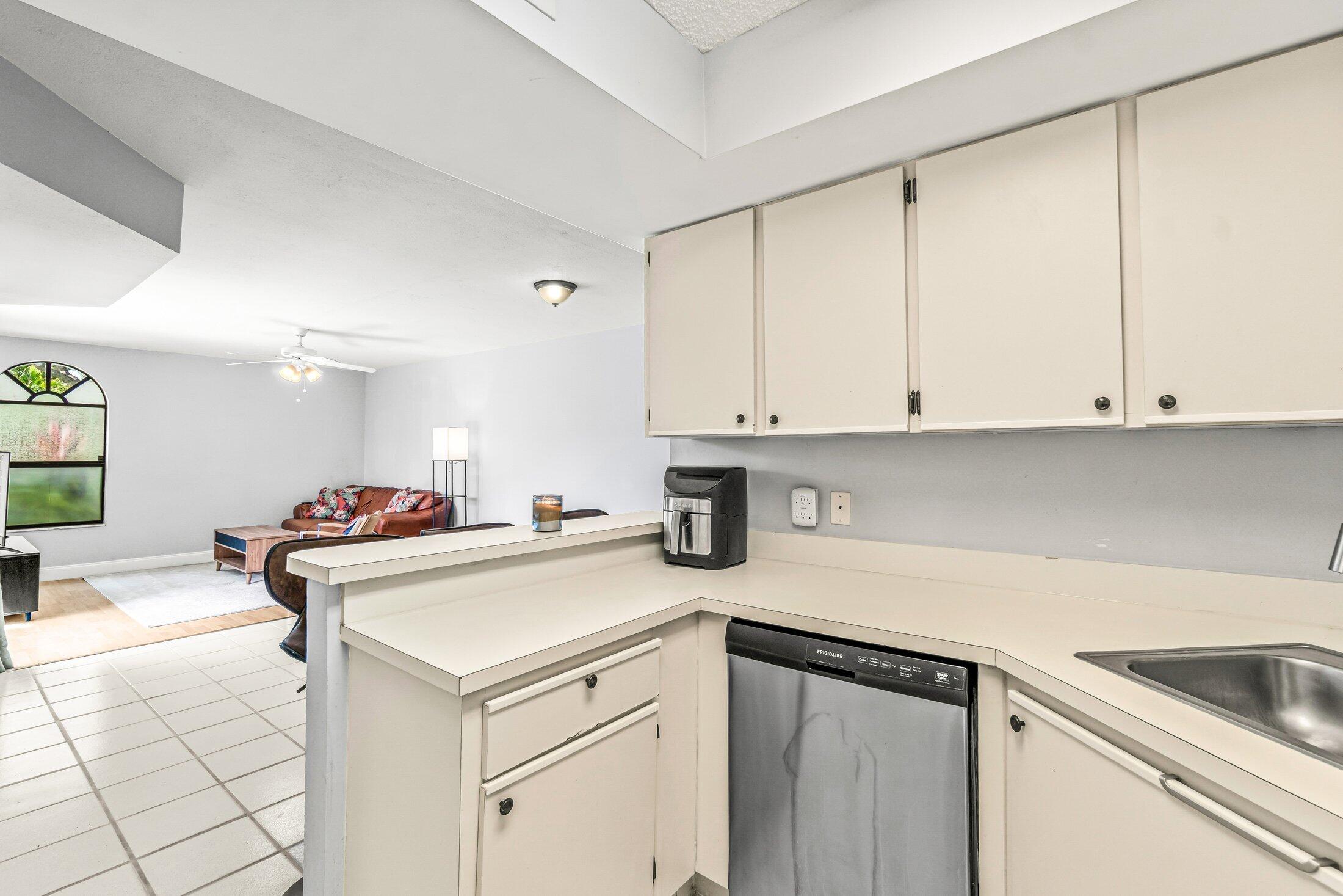 3900 Village Drive, Unit D Delray Beach, FL 33445 - Photo 18 of 43 Open kitchen facing living area