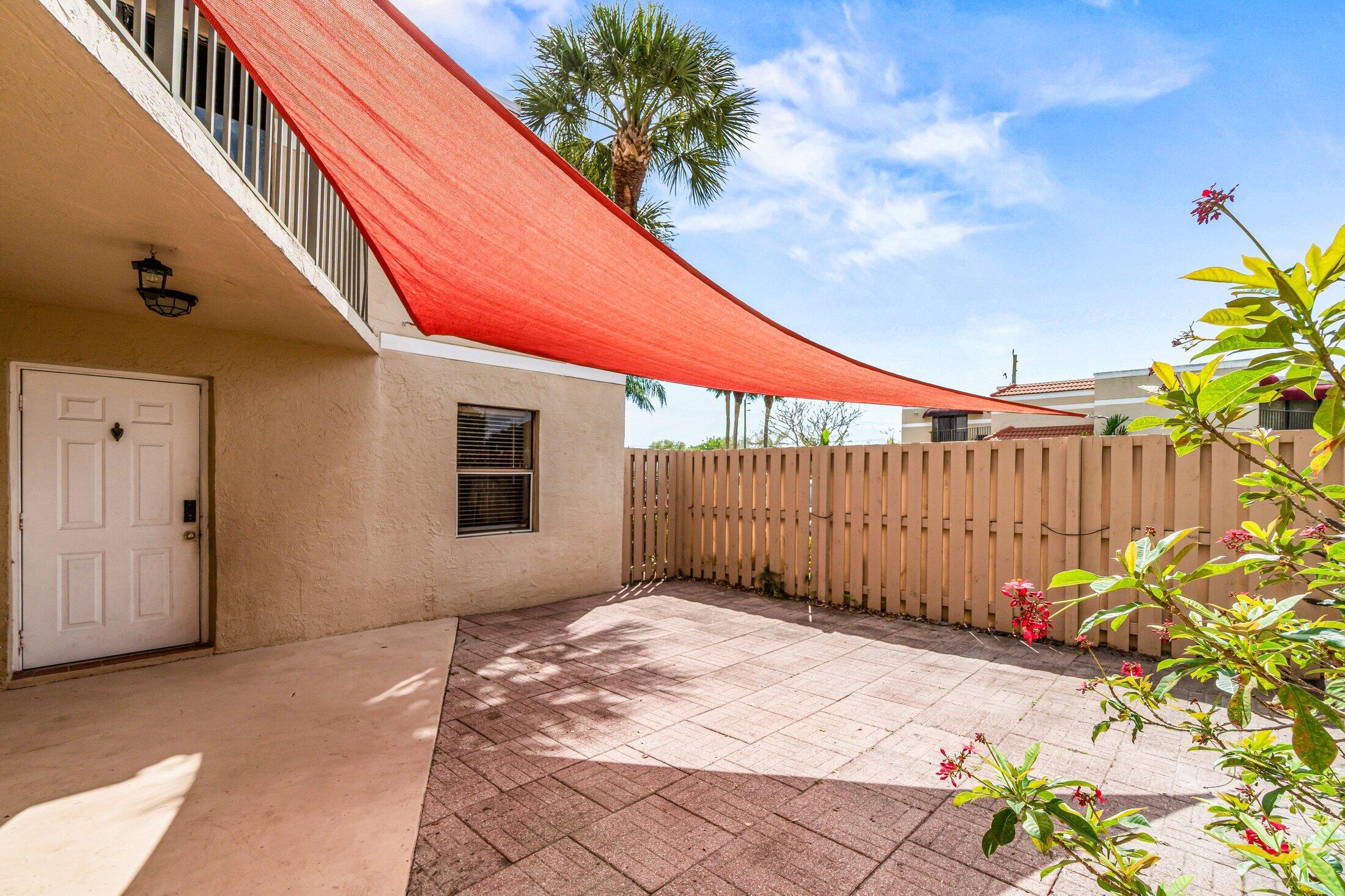 3900 Village Drive, Unit D Delray Beach, FL 33445 - Photo 8 of 43 Courtyard facing front door