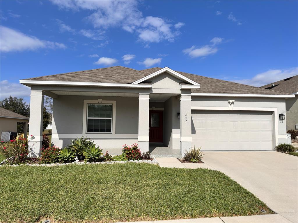 front view of a house with a yard