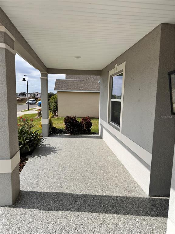 447 Pinecrest Loop Davenport, FL 33837 - Photo 2 of 23 a living room with furniture and a rug