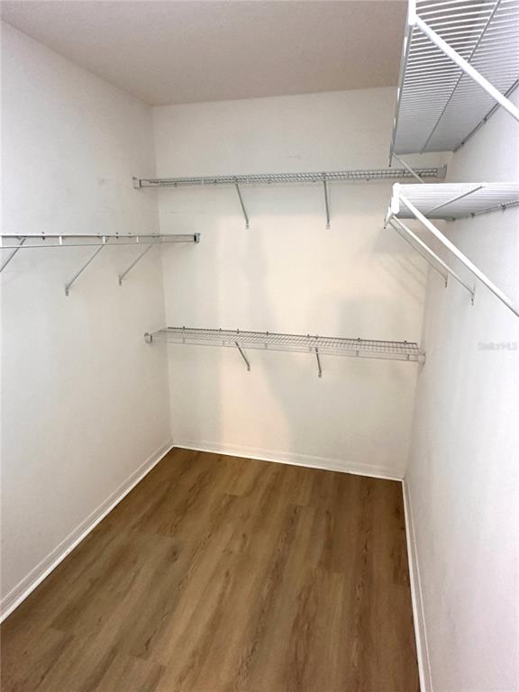 447 Pinecrest Loop Davenport, FL 33837 - Photo 22 of 23 a view of a room with racks on the wall