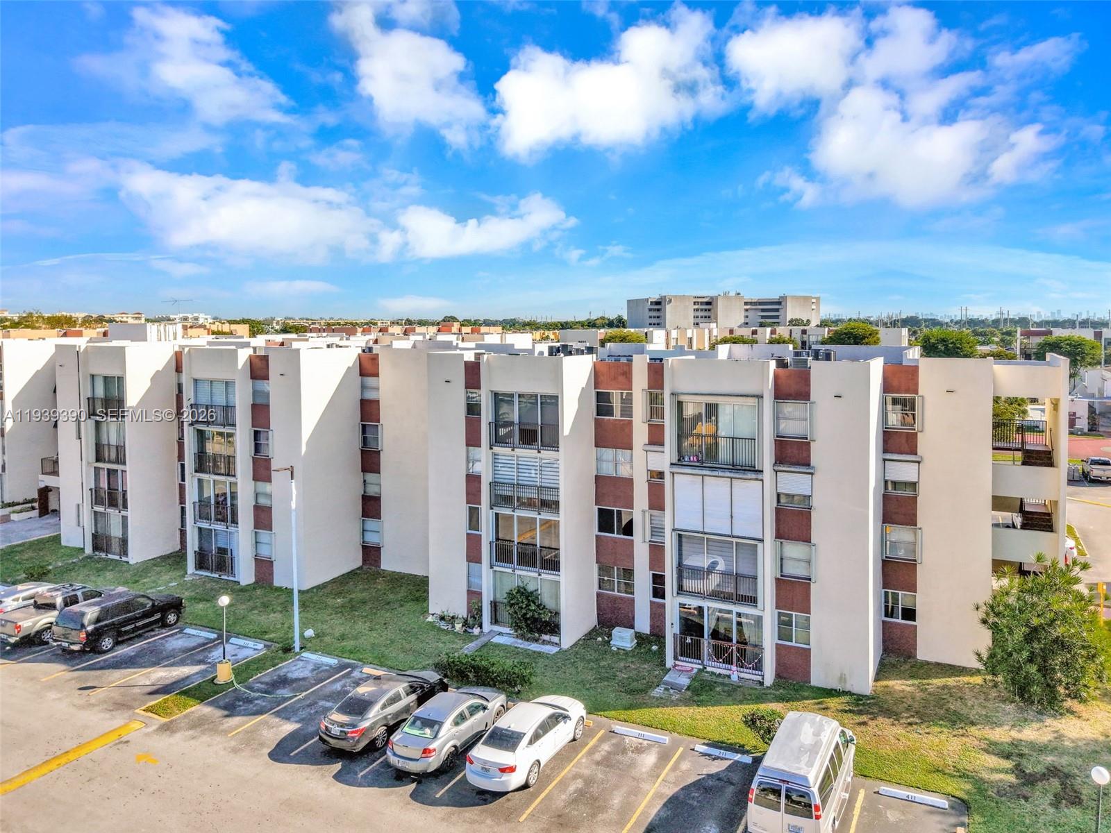 a view of a building with a yard