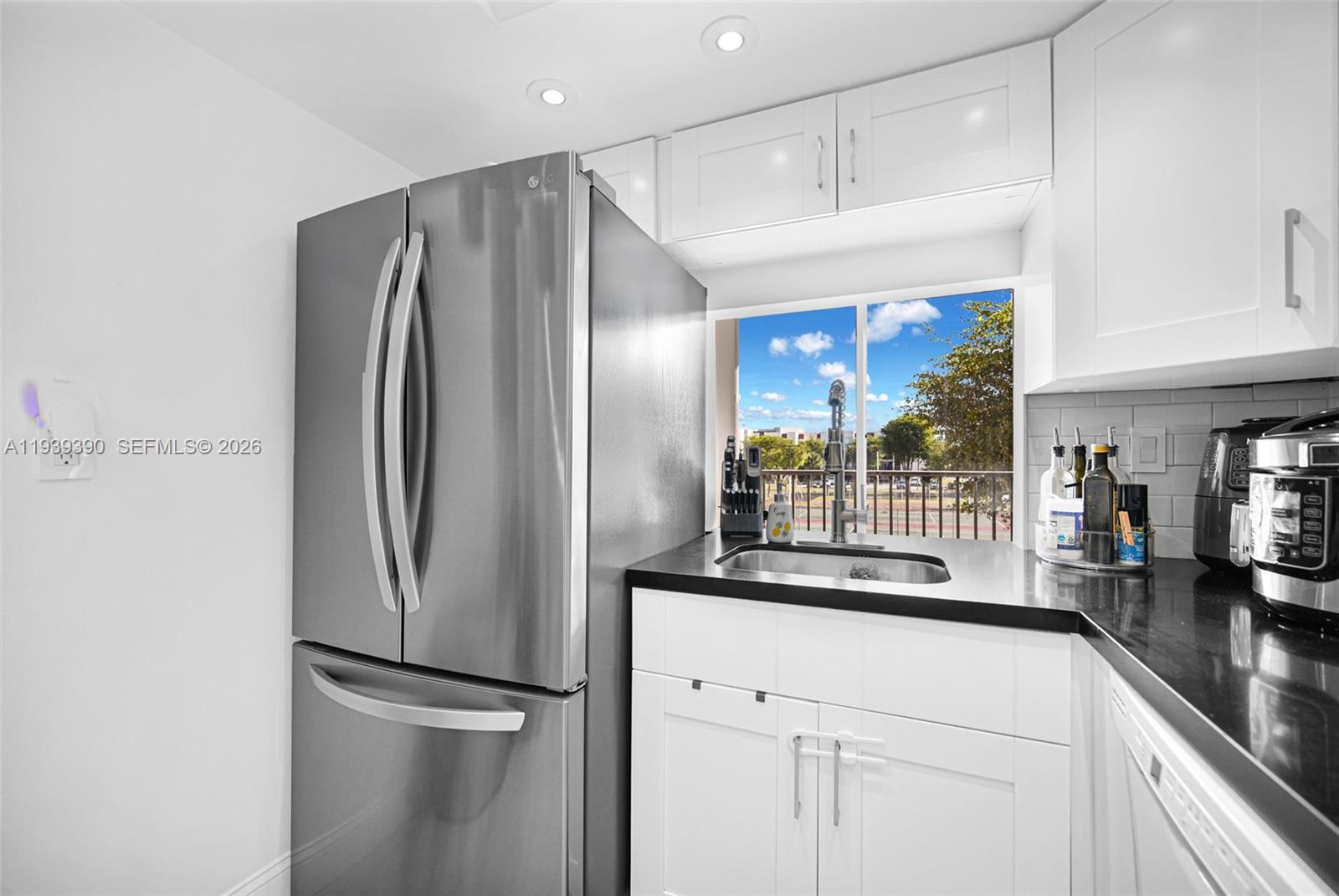 9441 Southwest 4th Street, Unit 309 Miami, FL 33174 - Photo 15 of 44 a kitchen with stainless steel appliances a refrigerator and a sink