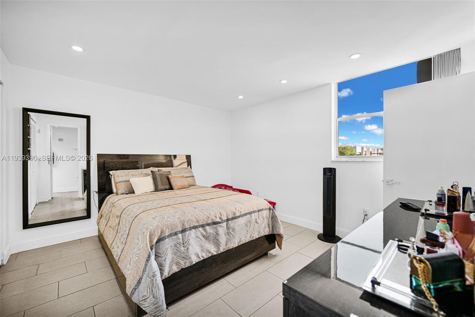 9441 Southwest 4th Street, Unit 309 Miami, FL 33174 - Photo 18 of 44 a bedroom with a bed and a desk