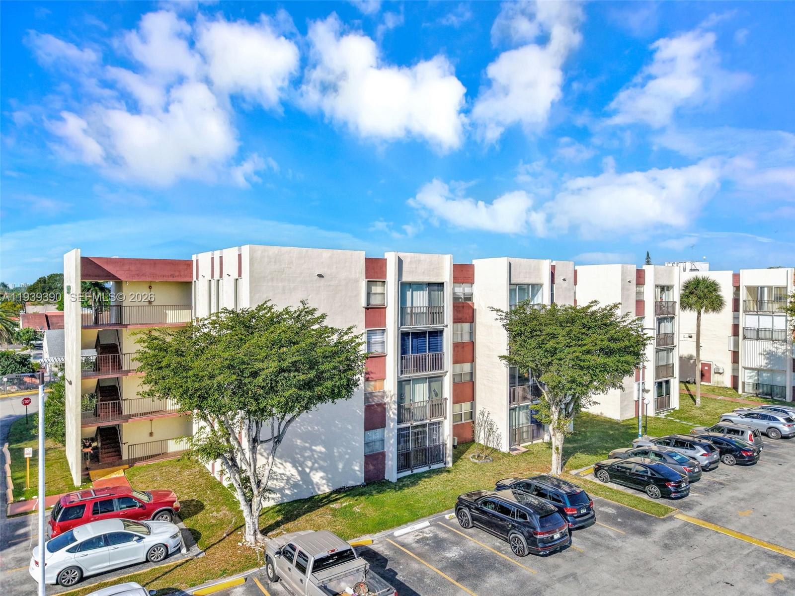 9441 Southwest 4th Street, Unit 309 Miami, FL 33174 - Photo 2 of 44 a view of a patio with table and chairs and potted plants