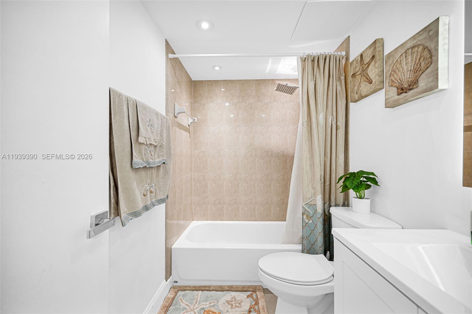 9441 Southwest 4th Street, Unit 309 Miami, FL 33174 - Photo 27 of 44 a bathroom with a toilet and a shower