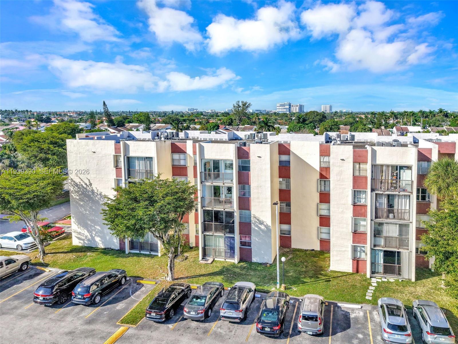 9441 Southwest 4th Street, Unit 309 Miami, FL 33174 - Photo 3 of 44 a view of a city with tall buildings