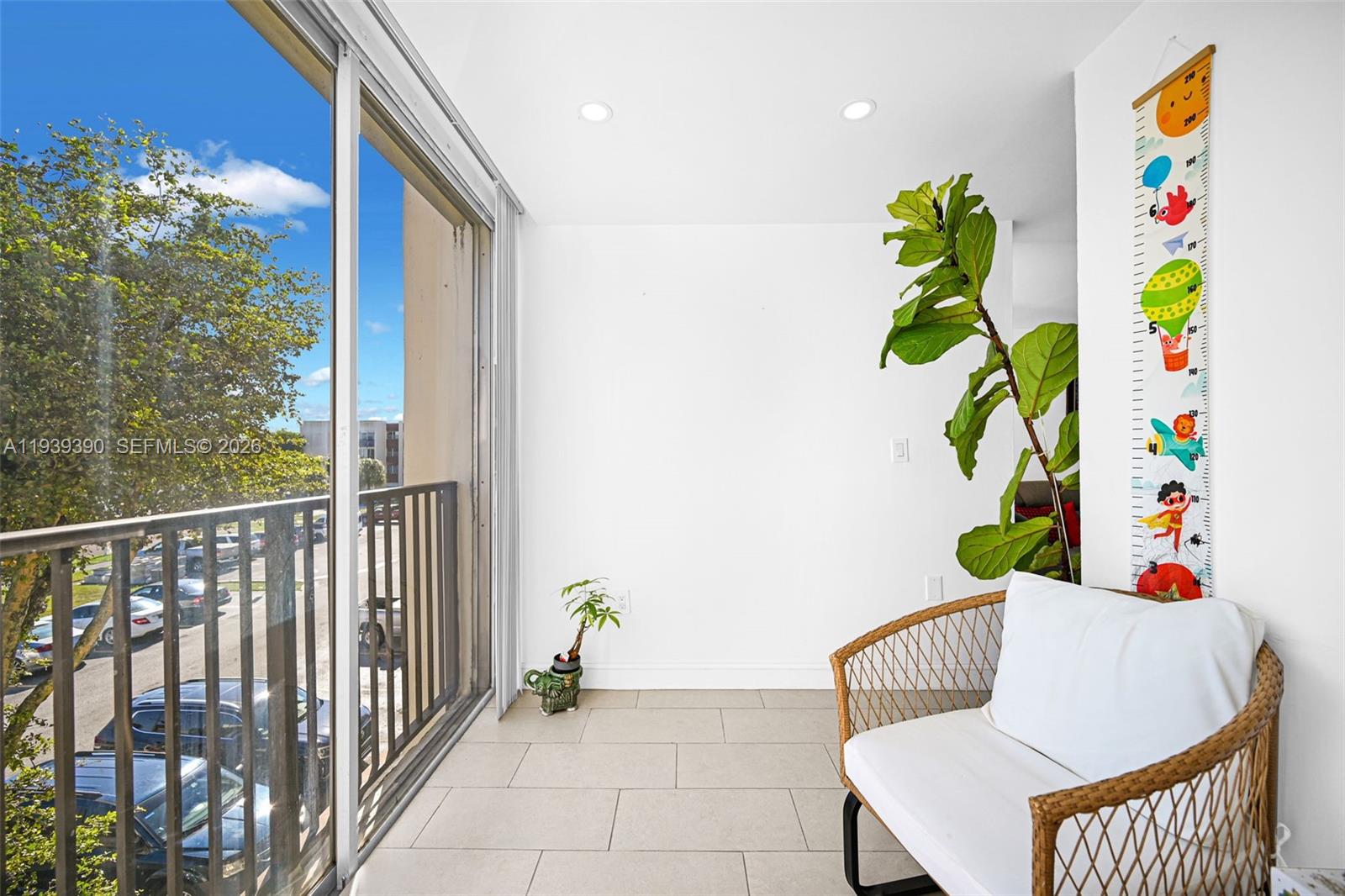 9441 Southwest 4th Street, Unit 309 Miami, FL 33174 - Photo 32 of 44 a living room filled with furniture and a potted plant