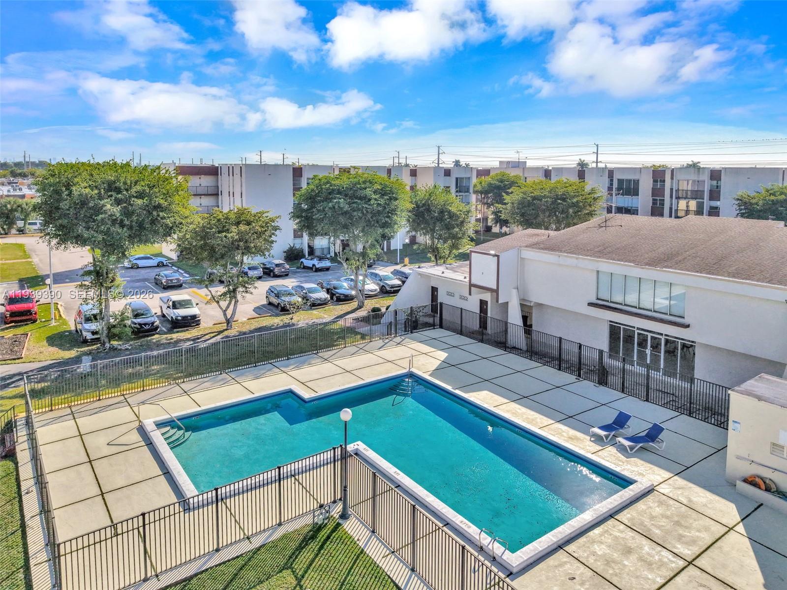 9441 Southwest 4th Street, Unit 309 Miami, FL 33174 - Photo 39 of 44 a view of a balcony with chairs and a table