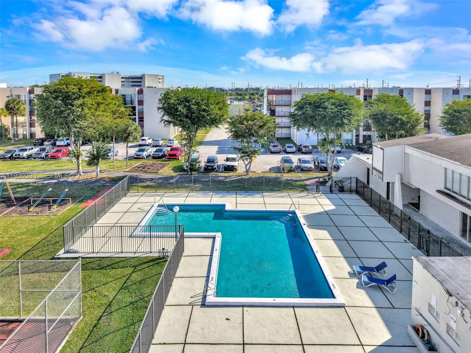 9441 Southwest 4th Street, Unit 309 Miami, FL 33174 - Photo 40 of 44 a view of swimming pool with chairs