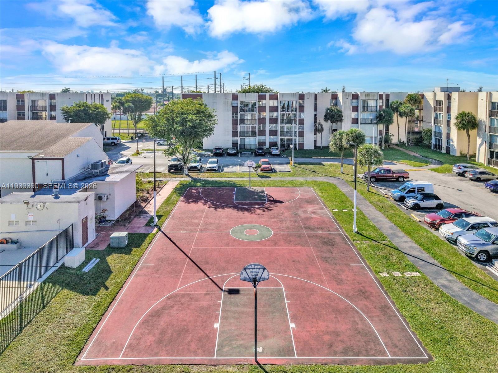 9441 Southwest 4th Street, Unit 309 Miami, FL 33174 - Photo 41 of 44 a view of a swimming pool with a lounge chairs
