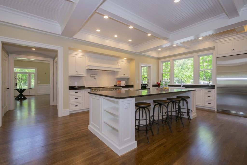 291 Emerson Road Lexington, MA 02420 - Photo 16 of 42 a kitchen with a table and chairs in it