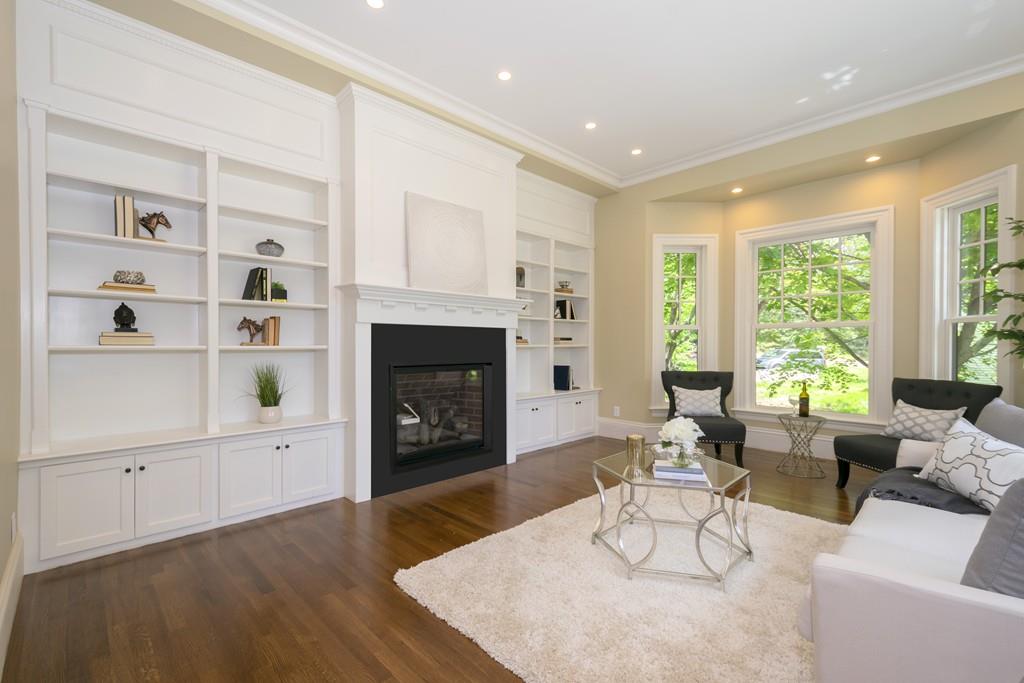 291 Emerson Road Lexington, MA 02420 - Photo 21 of 42 a living room with furniture and a fireplace
