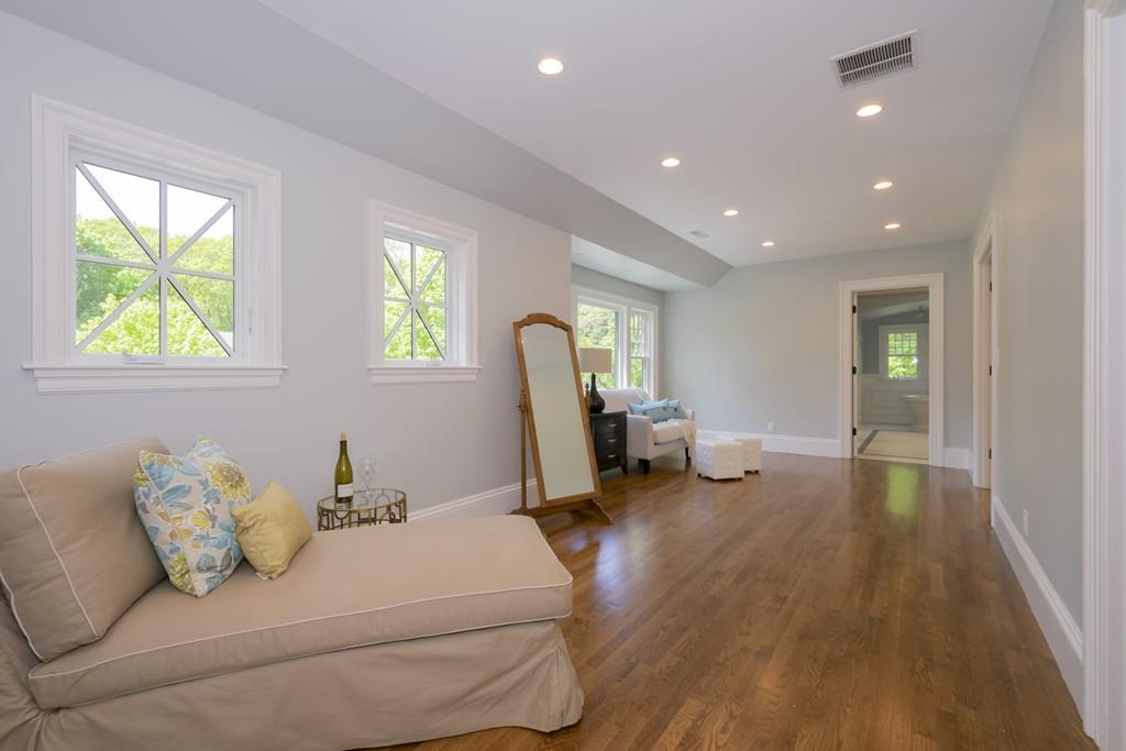 291 Emerson Road Lexington, MA 02420 - Photo 29 of 42 a living room with furniture and a window