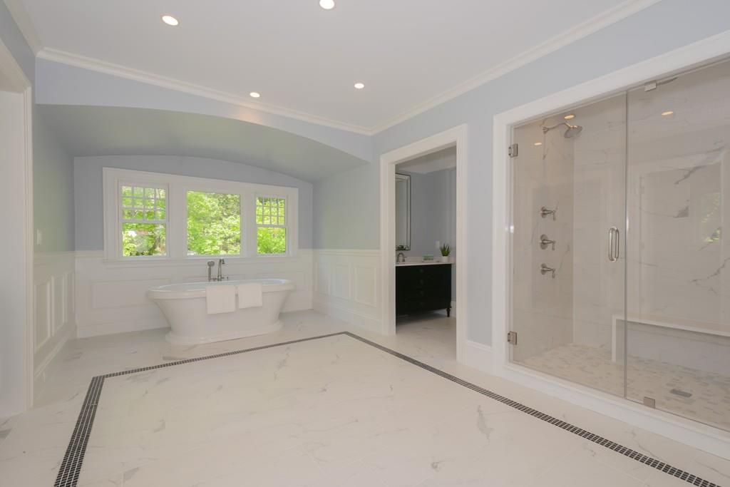 291 Emerson Road Lexington, MA 02420 - Photo 30 of 42 a bathroom with a bathtub and a shower
