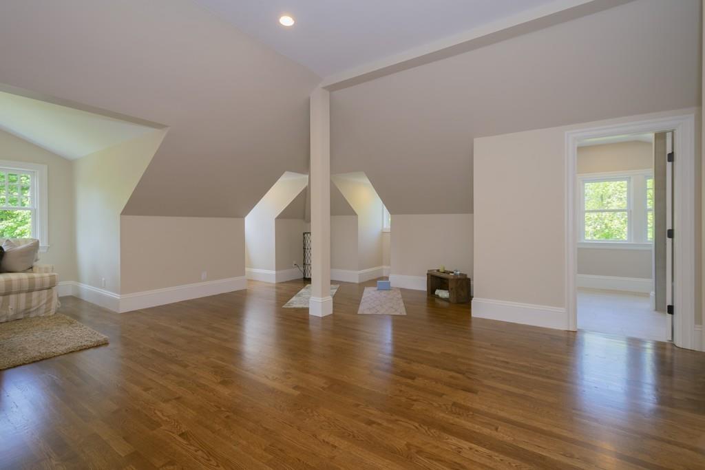 291 Emerson Road Lexington, MA 02420 - Photo 34 of 42 a view of an empty room with wooden floor and a window
