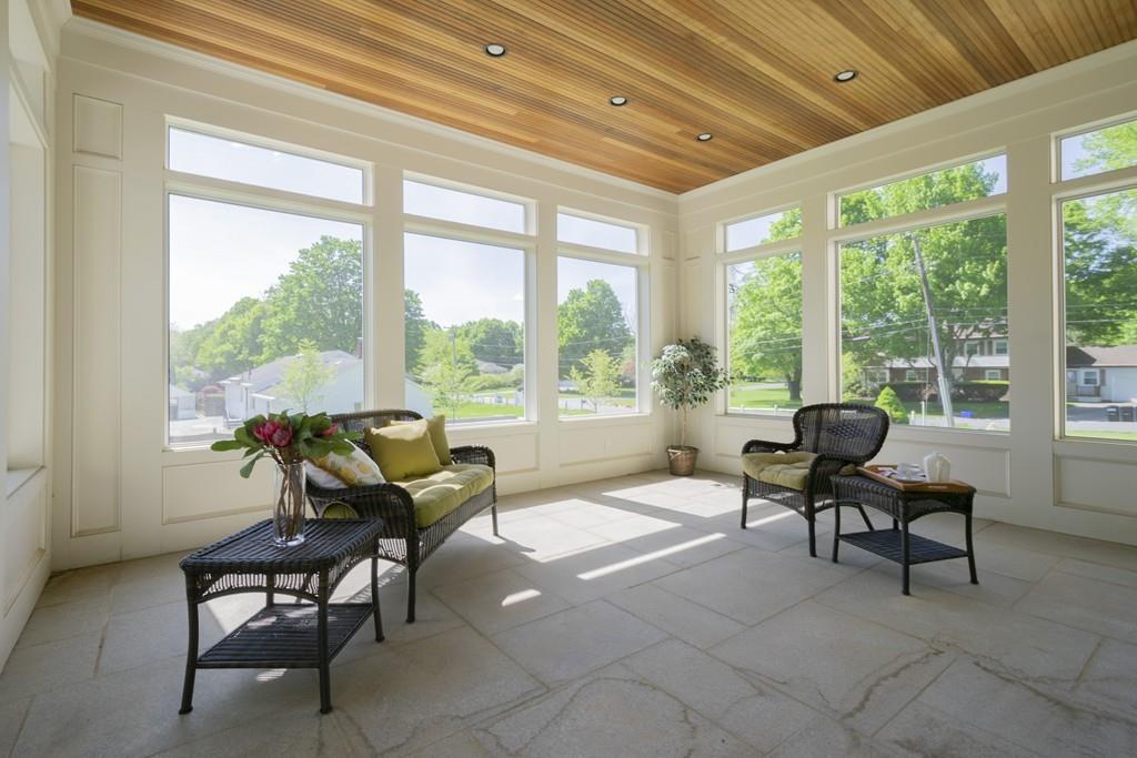 291 Emerson Road Lexington, MA 02420 - Photo 37 of 42 a living room with furniture and a floor to ceiling window