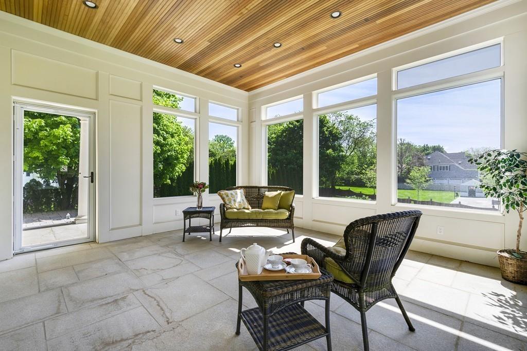 291 Emerson Road Lexington, MA 02420 - Photo 38 of 42 a living room with furniture and a floor to ceiling window