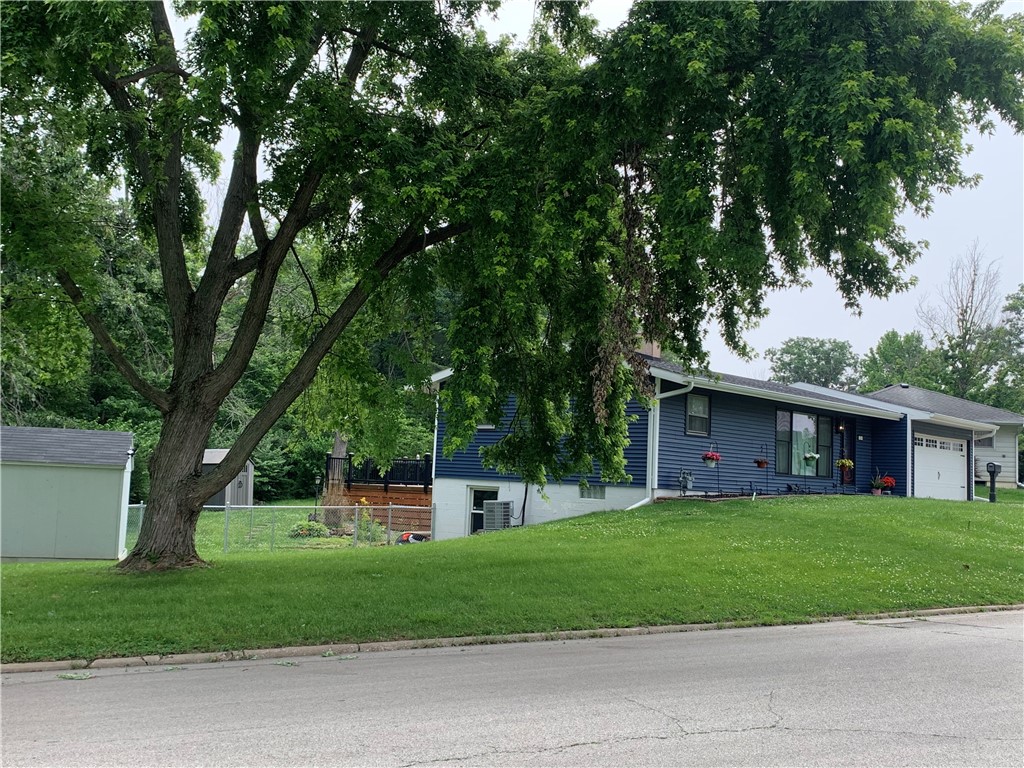 26 Sandcreek Drive Decatur, IL 62521 - Photo 2 of 29 a view of a house next to a big yard and large trees