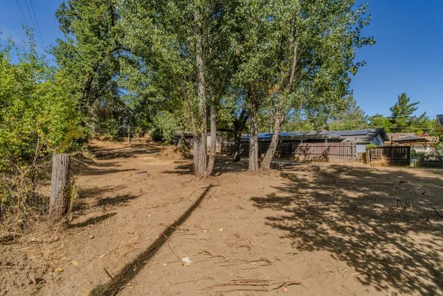 a backyard of a house with lots of green space