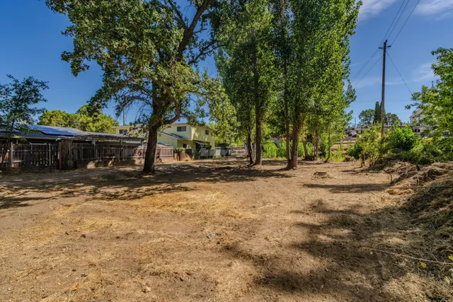a view of house with tree s