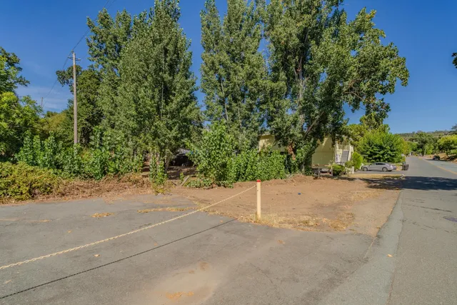 an empty view of a house with a street