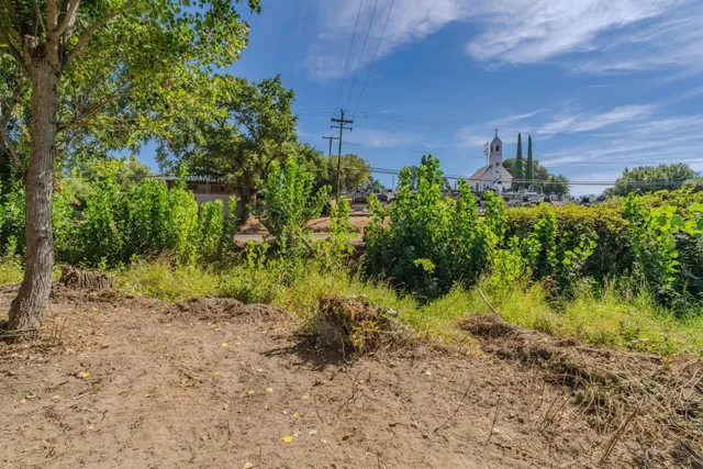 a backyard of a house with lots of green space