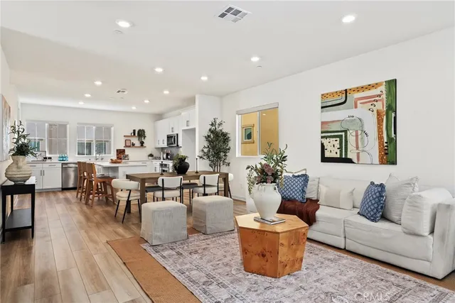a living room with furniture and a table