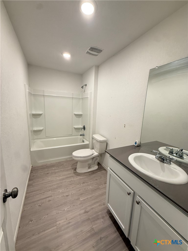 5863 Coahulia Ridge Seguin, TX 78155 - Photo 9 of 15 a bathroom with a sink a toilet and shower
