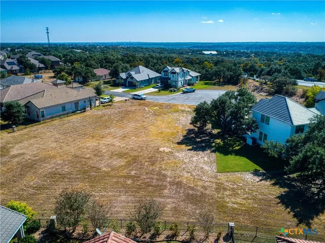 an aerial view of a house with outdoor space