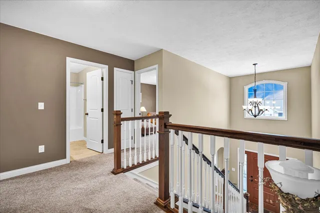 a view of staircase with rug